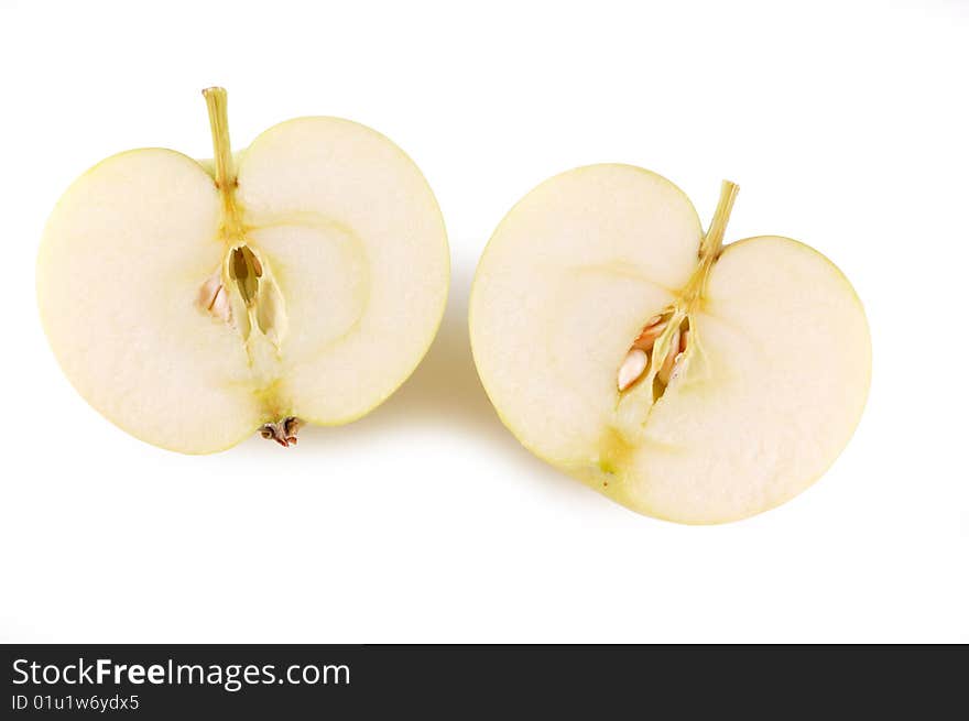 Cut green apple on a white background