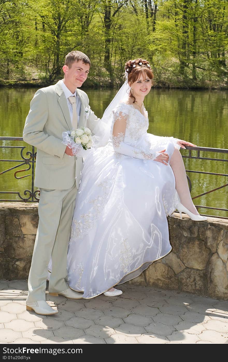 The Groom And The Bride On Lake.