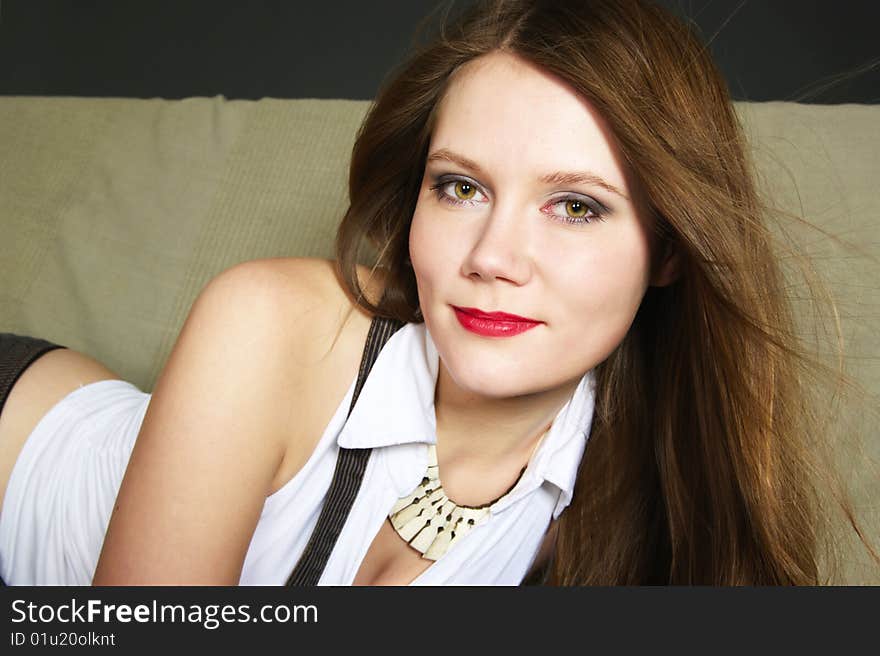 Smiling young woman with long red hair. Smiling young woman with long red hair