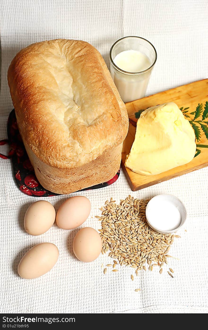 Bread and eggs on a cloth by a dinner. Bread and eggs on a cloth by a dinner