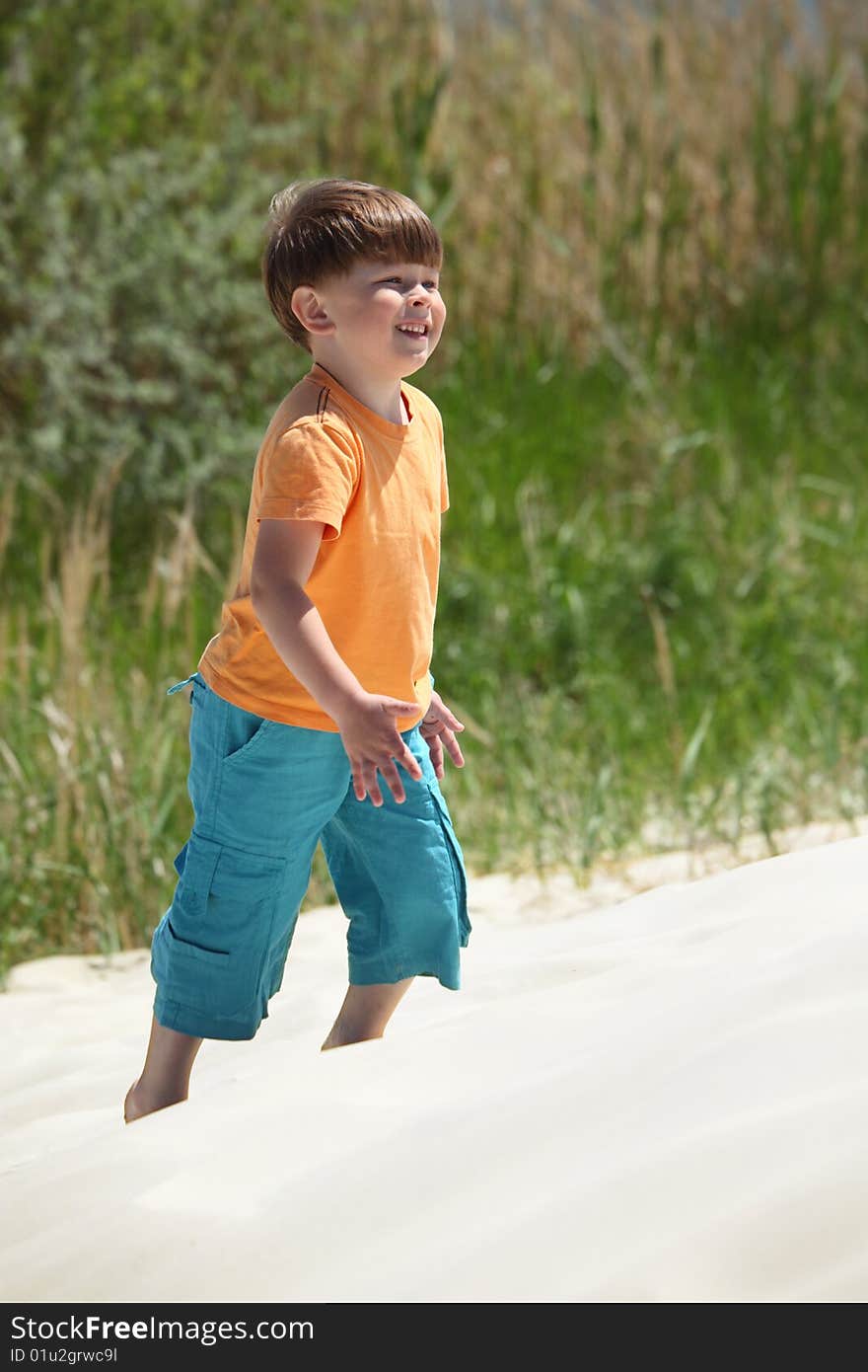 Boy Goes On Sand,  Side View