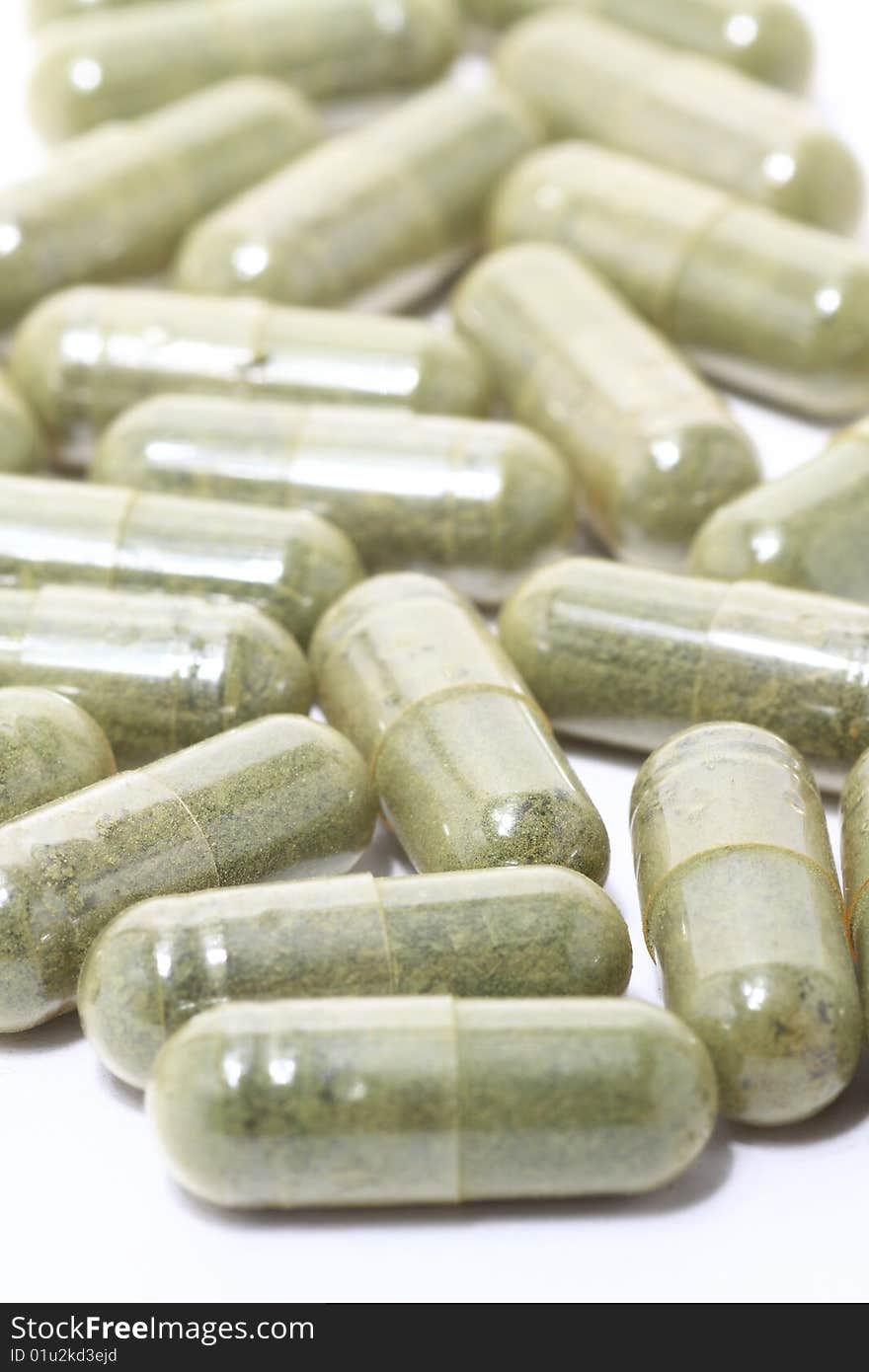 Green Pills on white background