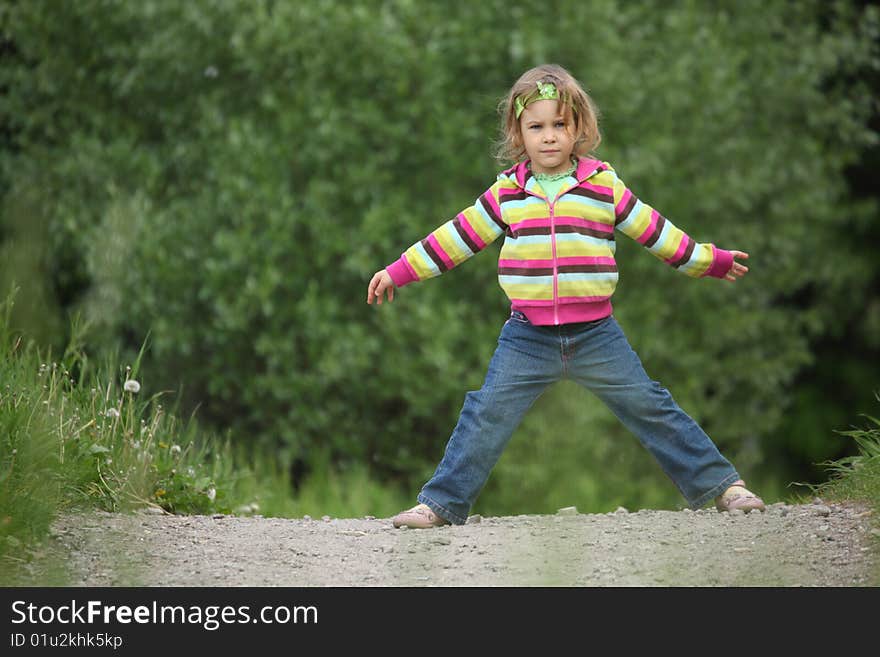 Girl makes gymnastic in park