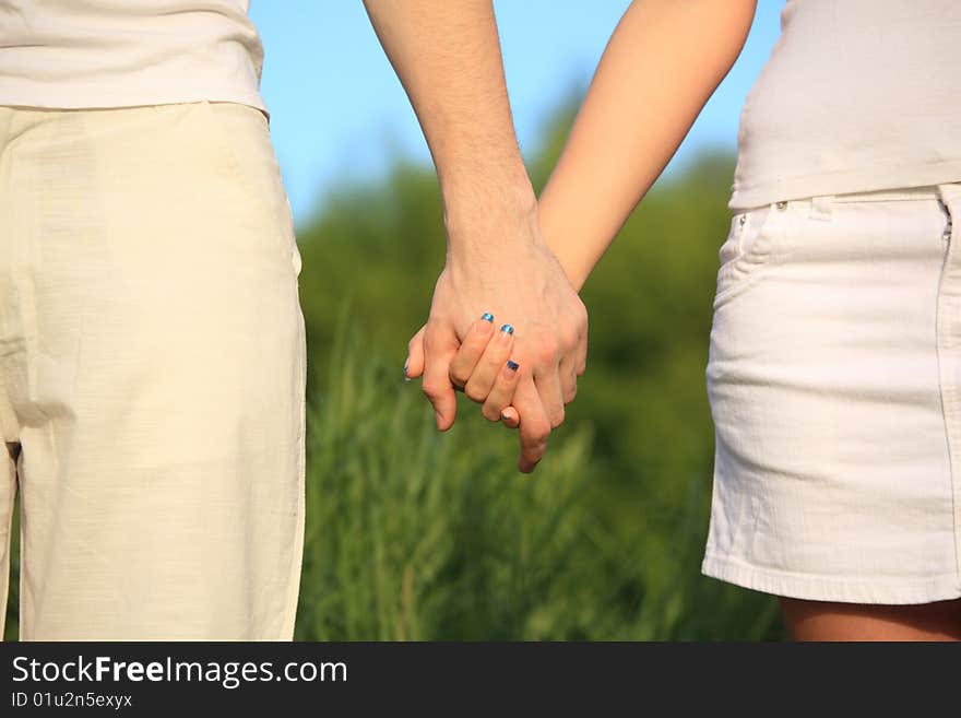 Man's and female's hands to be held for each other