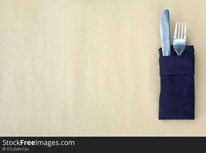 Knife and fork on a table. Knife and fork on a table