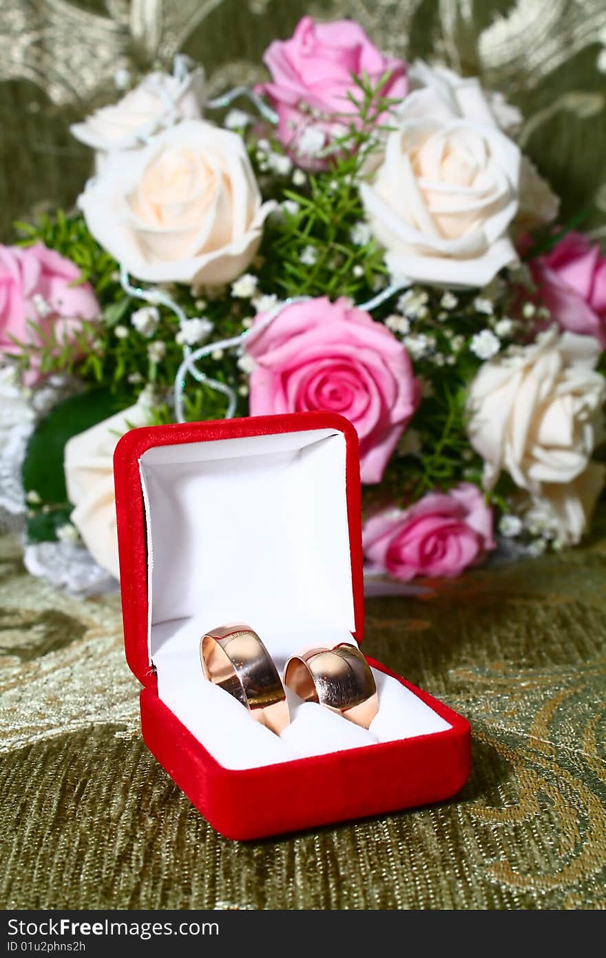 Two Wedding Rings In Box And Flowers