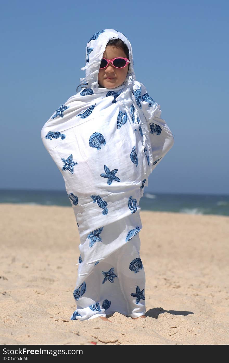 A cute little girl on the beach