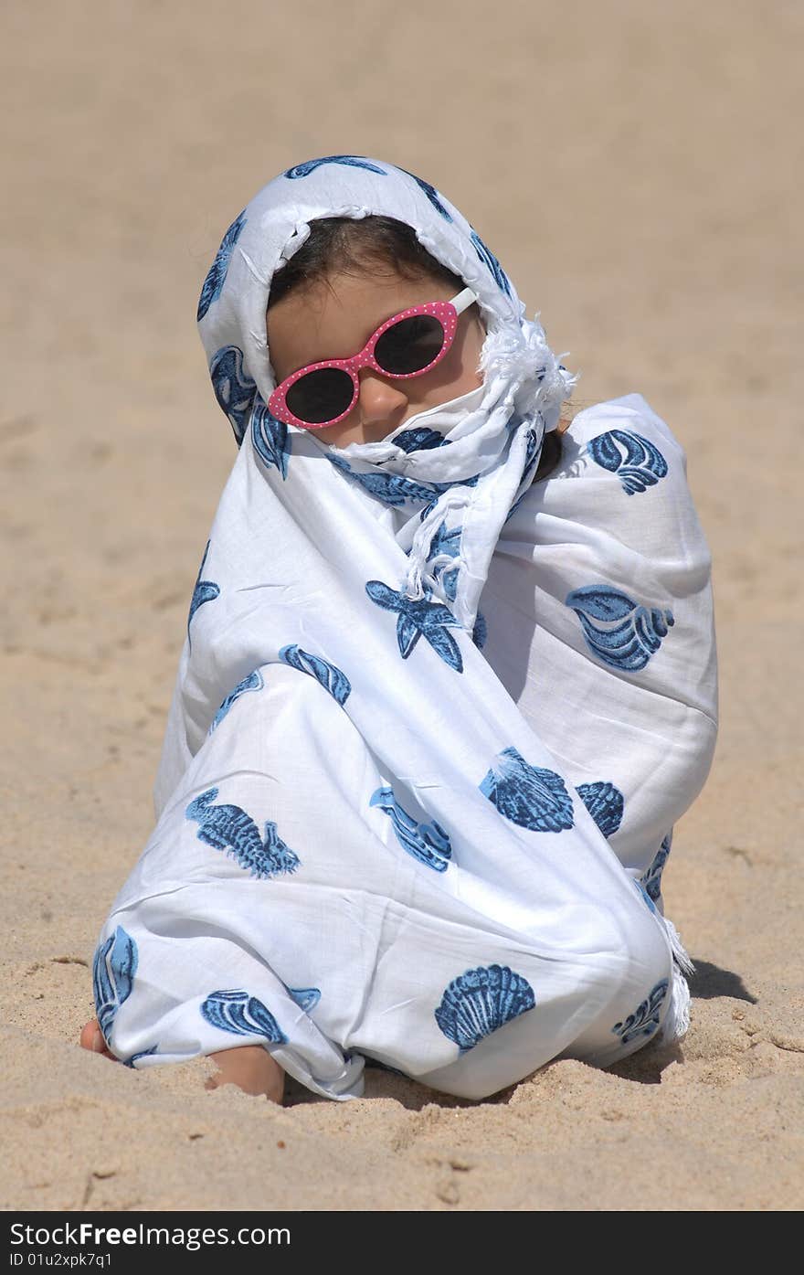 A cute little girl on the beach