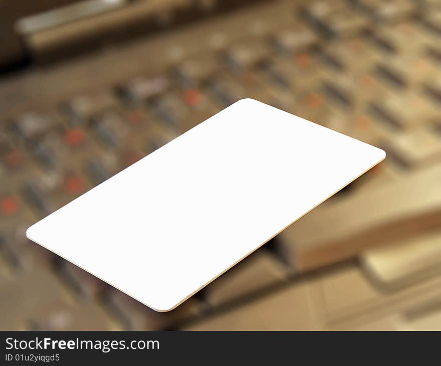 Blank credit card against a keyboard.