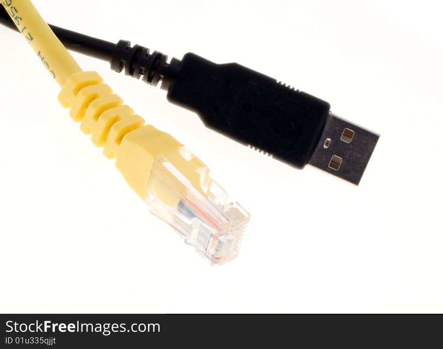 A yellow lan and a black usb connector over a white background. A yellow lan and a black usb connector over a white background.