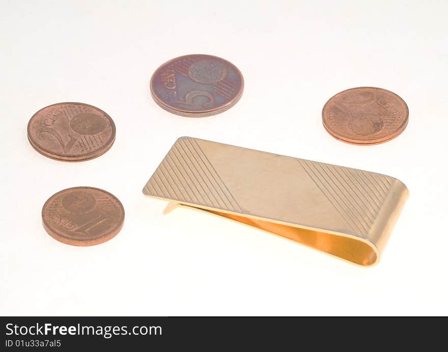 Empty money clip with five, two and one euro cent coins over a white background. Empty money clip with five, two and one euro cent coins over a white background.