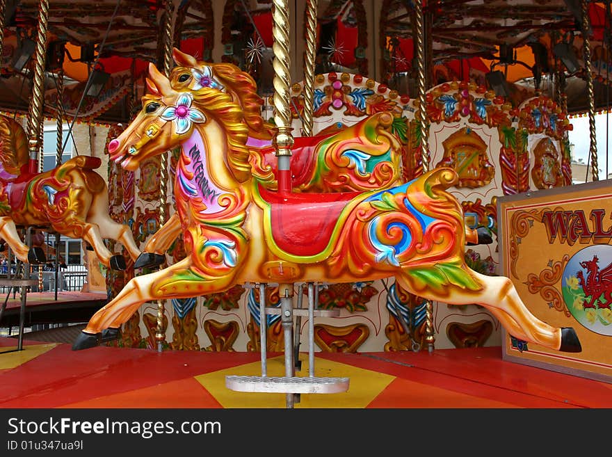 Brightly colored horses of carousel. Brightly colored horses of carousel