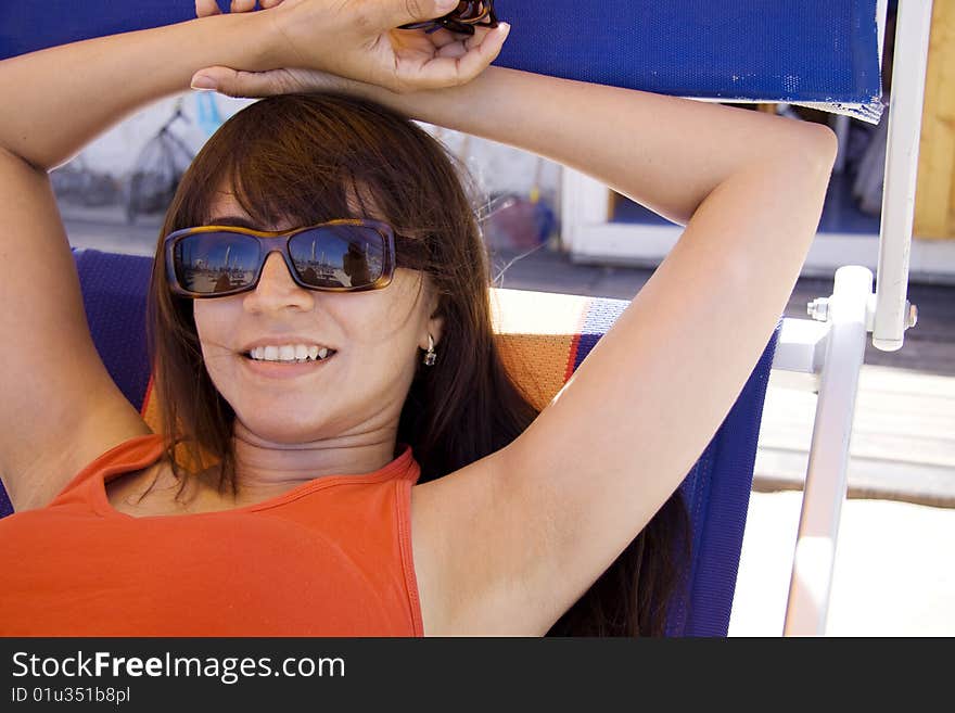 Woman relaxing in a beach chair