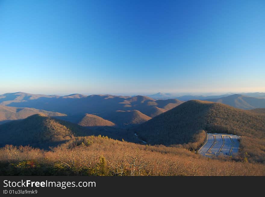 Late afternoon view of a parking lot built into a mountain side at the foot of the Appalachians. Late afternoon view of a parking lot built into a mountain side at the foot of the Appalachians.