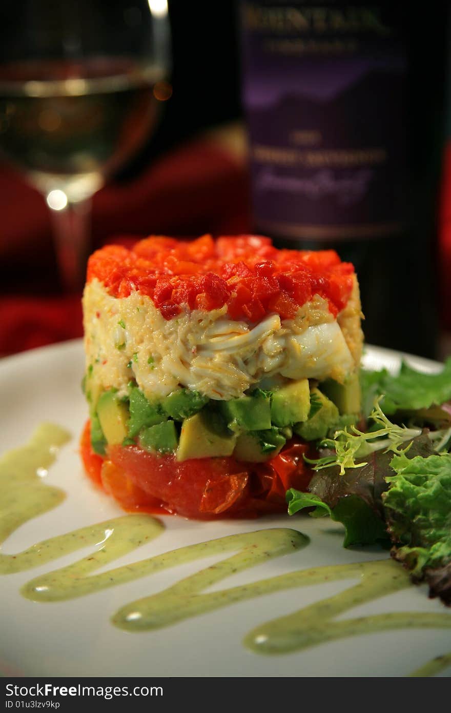 Tuna Stack with raw tuna, crab, avocado, avaocado sauce, lettuce, white wine.