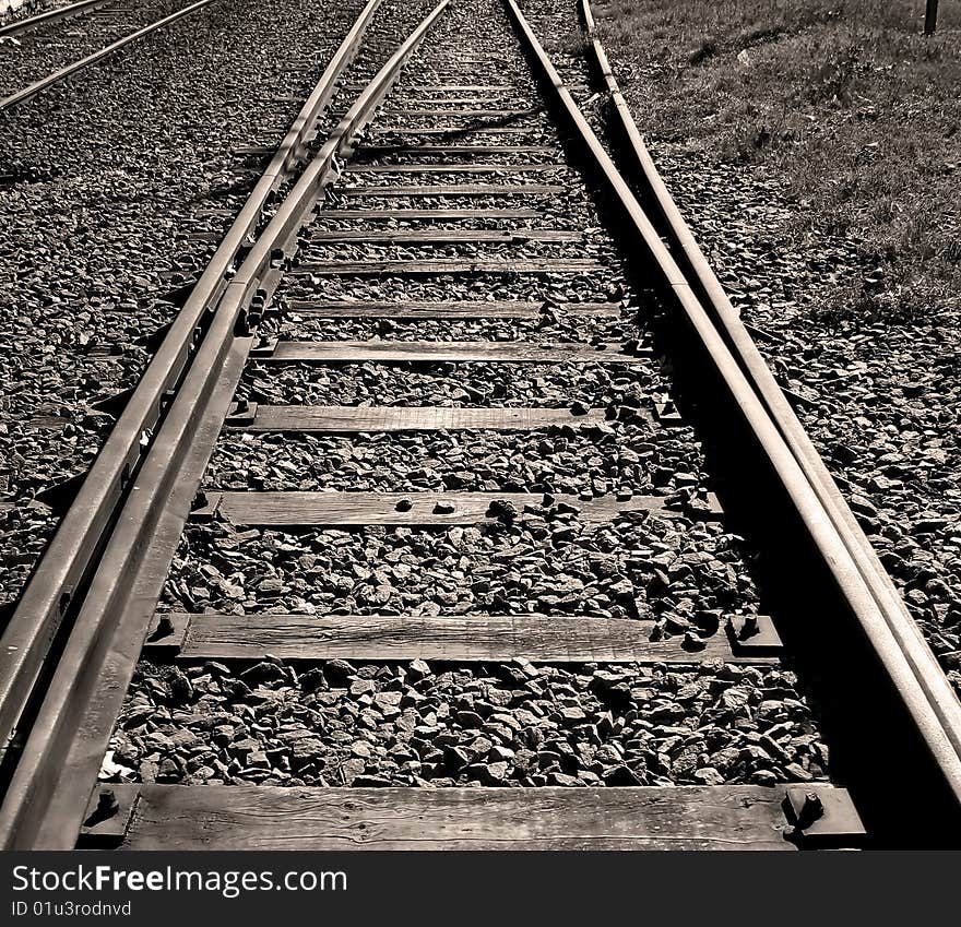 Perspective of a railroad track in black and white. Perspective of a railroad track in black and white.