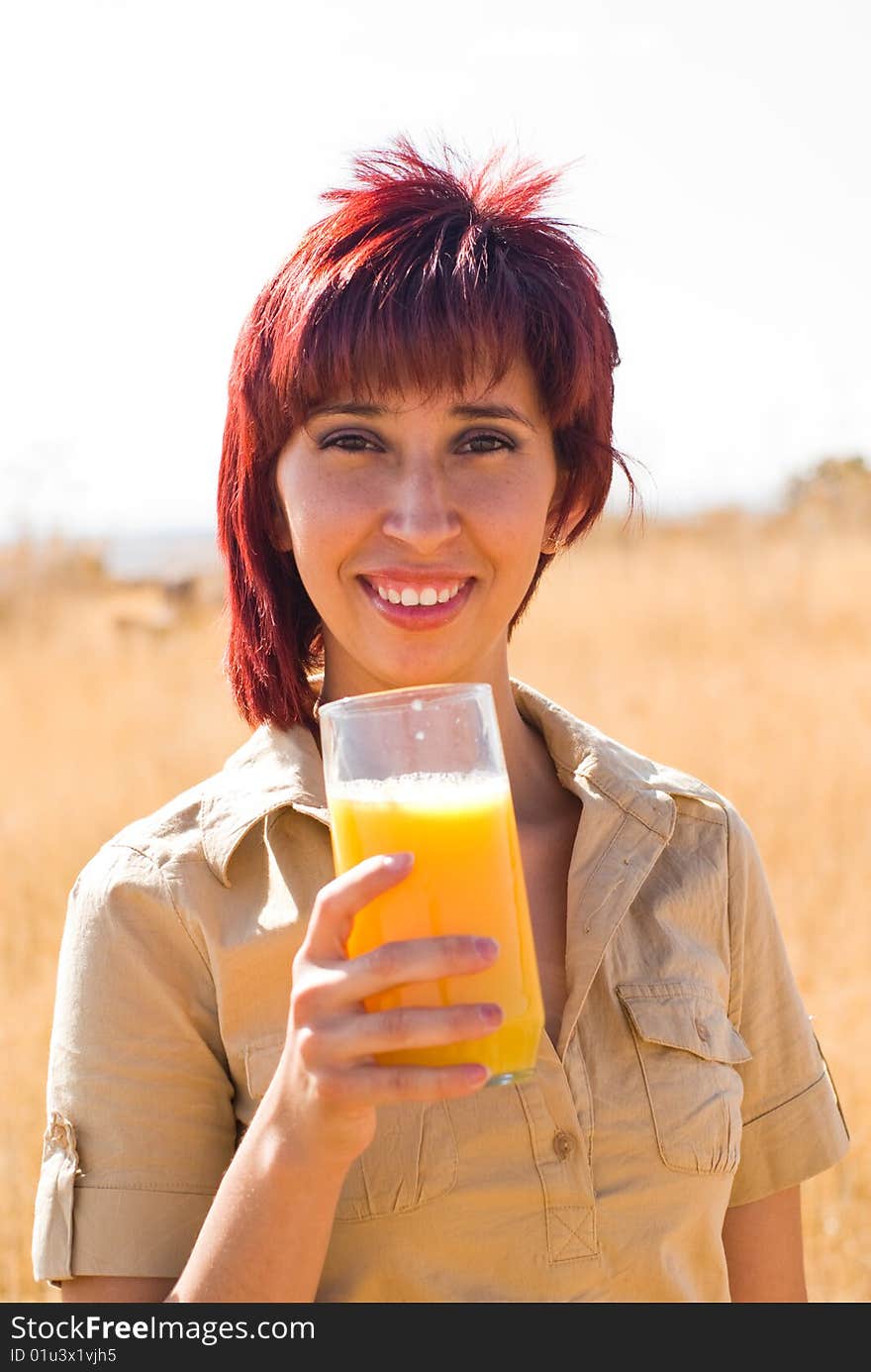 Woman happy drinking a orange juice