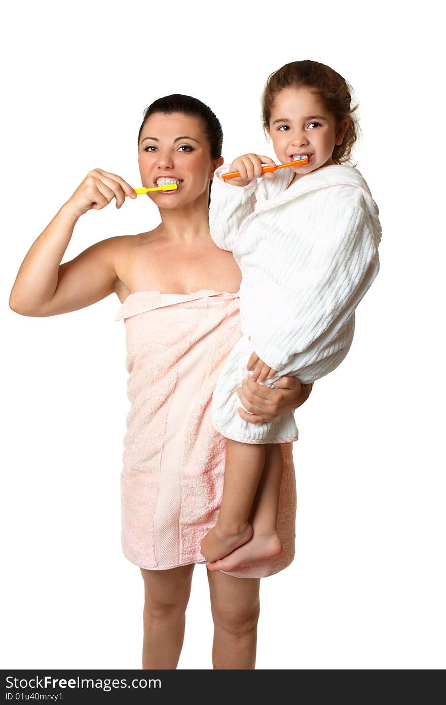 Mother and daughter brushing their teeth