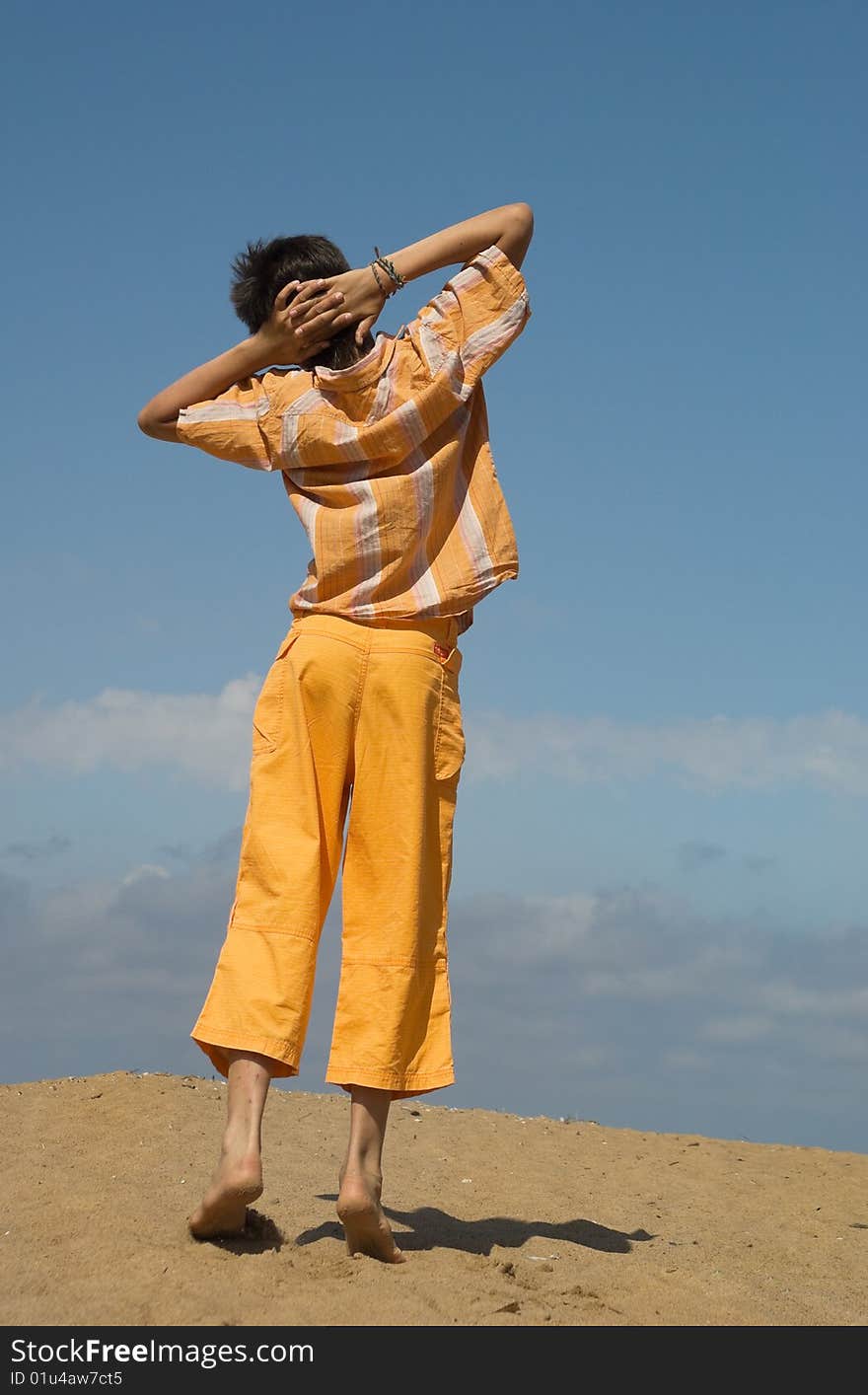 The teenager on sea sand