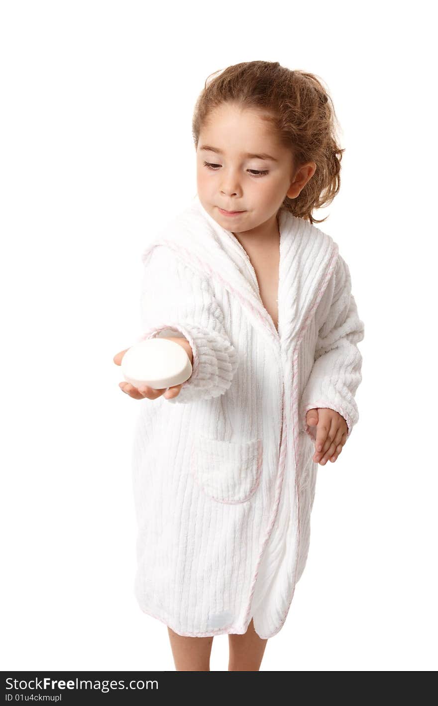 Beautiful young girl holding a bar of soap in the palm of her hand. Beautiful young girl holding a bar of soap in the palm of her hand.