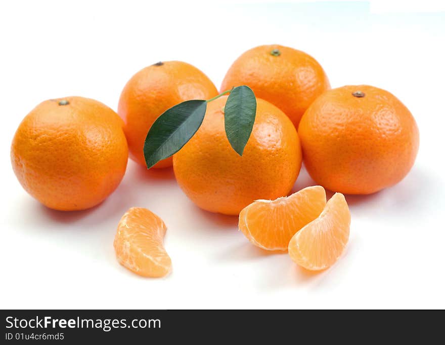 Clementines with segments on a white background