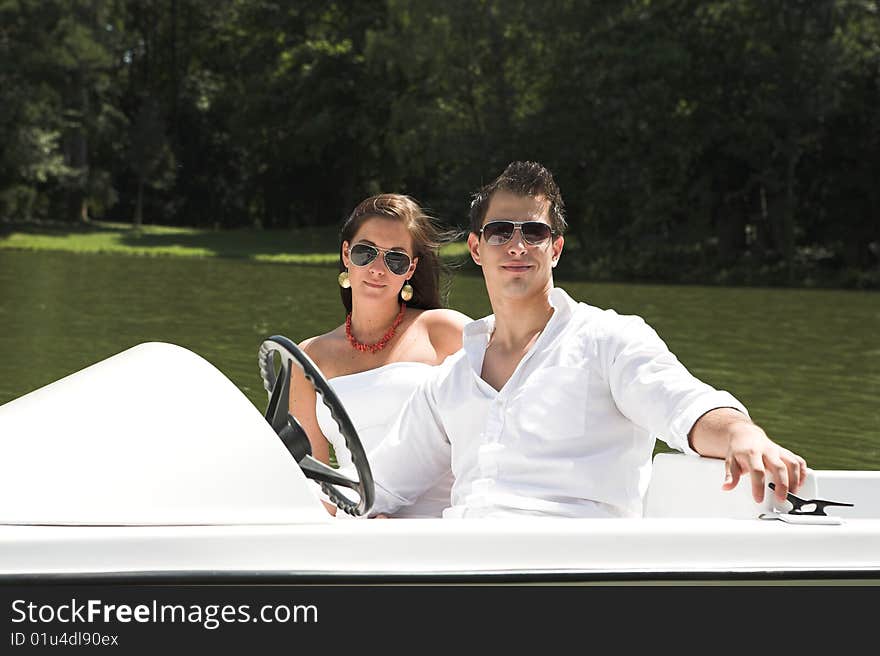 Young attractive couple on boat