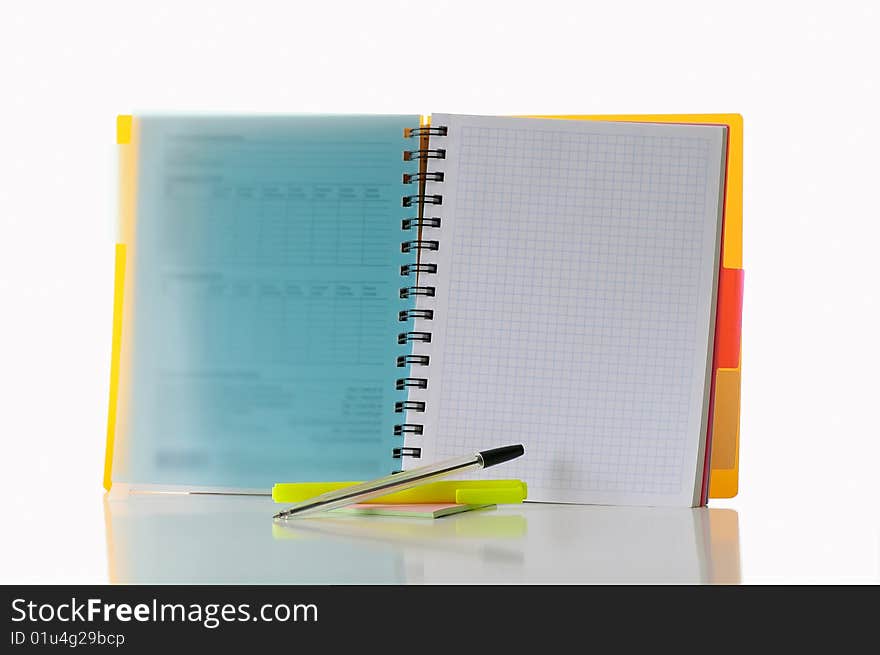 Open notebook with  marker against the white background. Open notebook with  marker against the white background