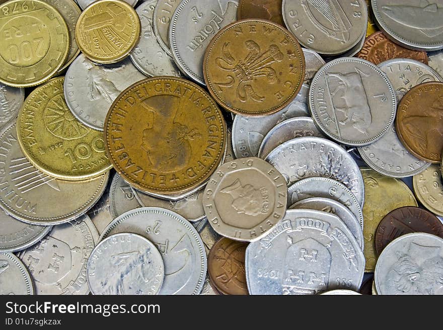 A mixture of old coins that were used before the euro.