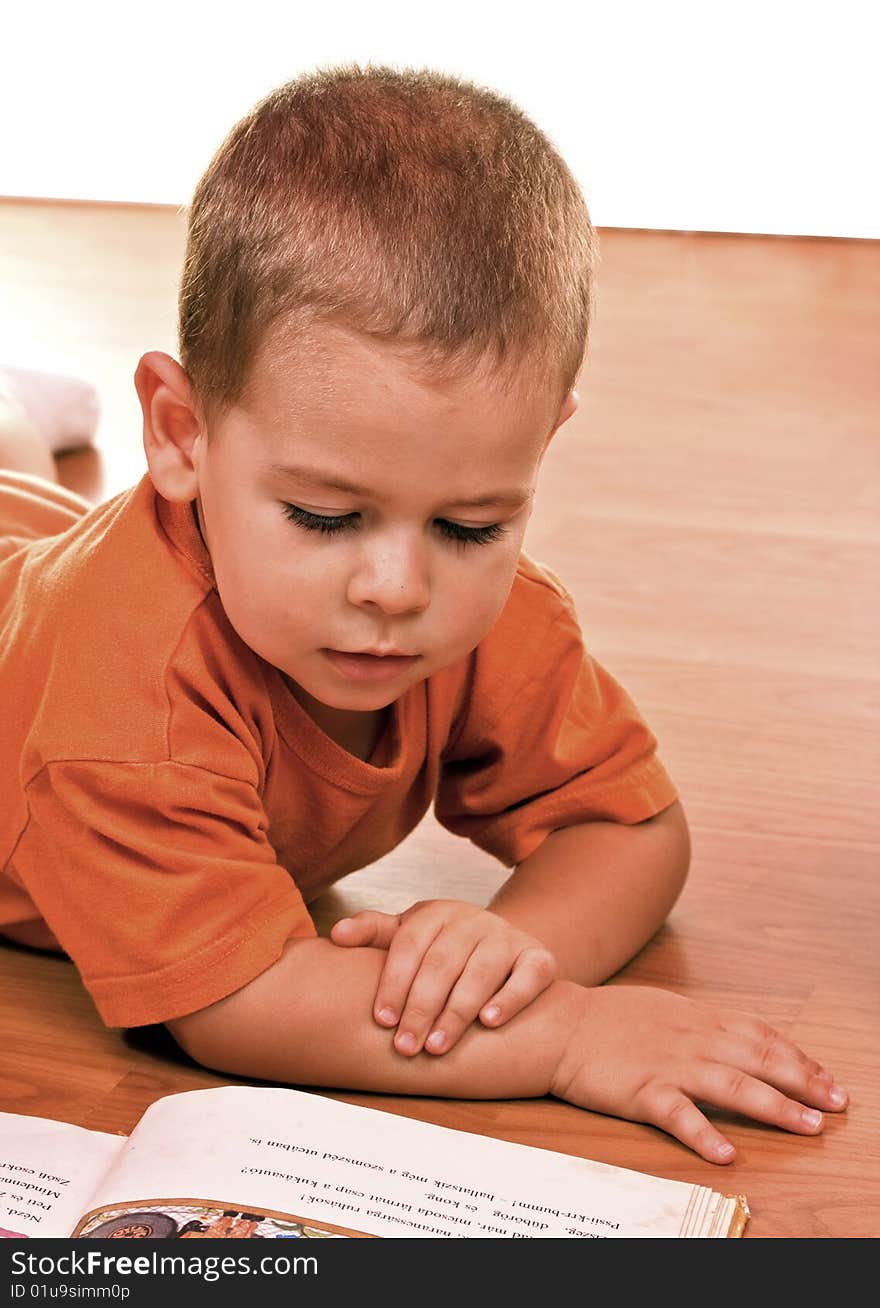 Little boy reading picture book. Little boy reading picture book