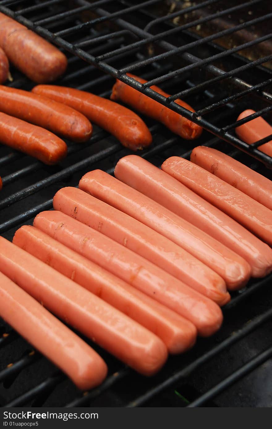 Hot Dog Sausages On Barbecue