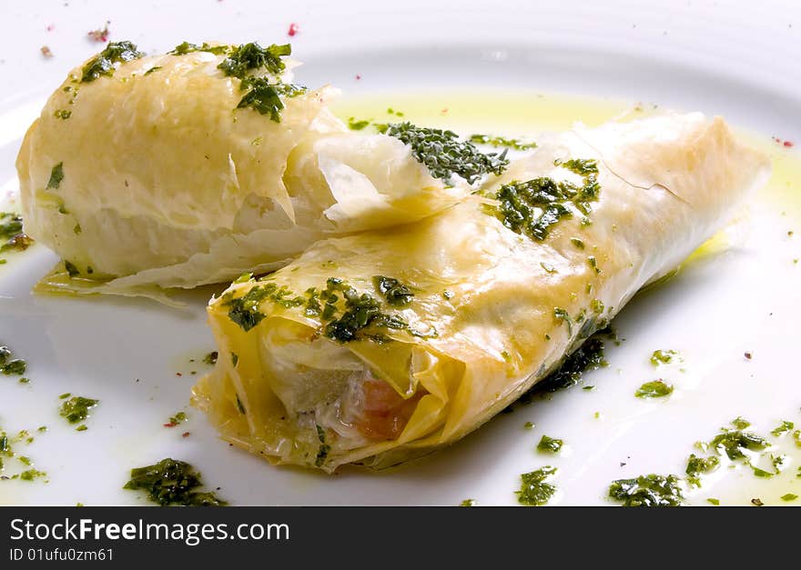 Baked apples in puff pastry on a plate