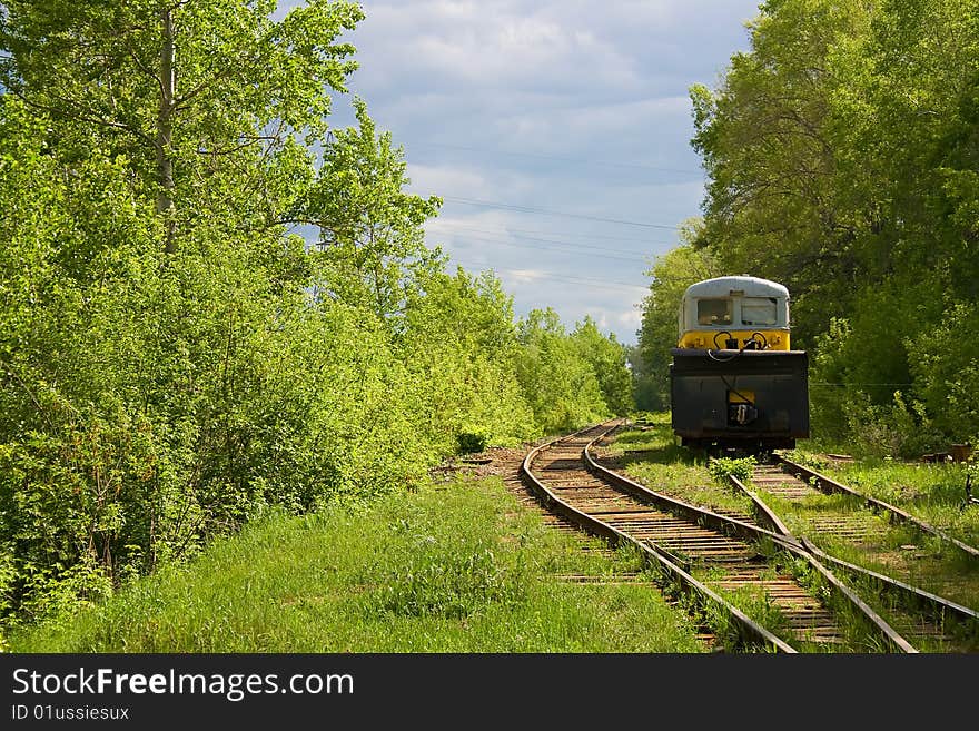 New great railroad symphony, summer scene of train and trees.