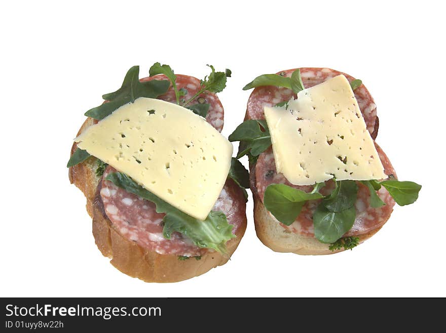 Two sandwiches with salami sausage and sliced cheese isolate