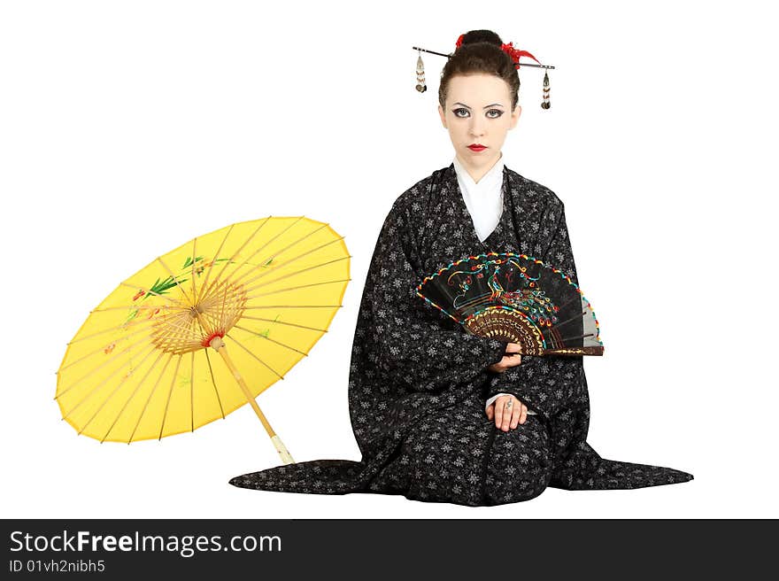 The Japanese geisha on a white background with a fan and an umbrella