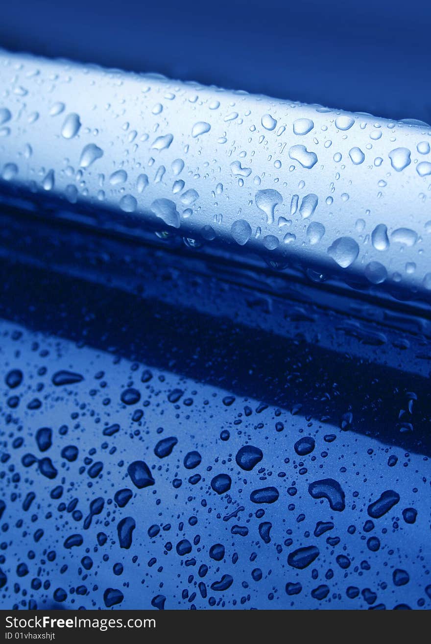 Water drops on blue metal