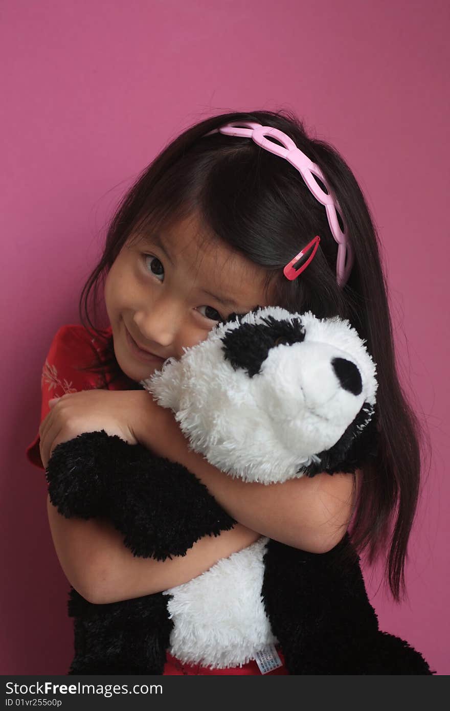 Little chinese girl with Panda Bear