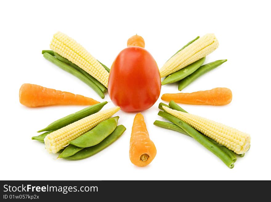 Healthy eating - fresh baby vegetables mix with carrots, beans, corn and tomato. Isolated over white background. Healthy eating - fresh baby vegetables mix with carrots, beans, corn and tomato. Isolated over white background.