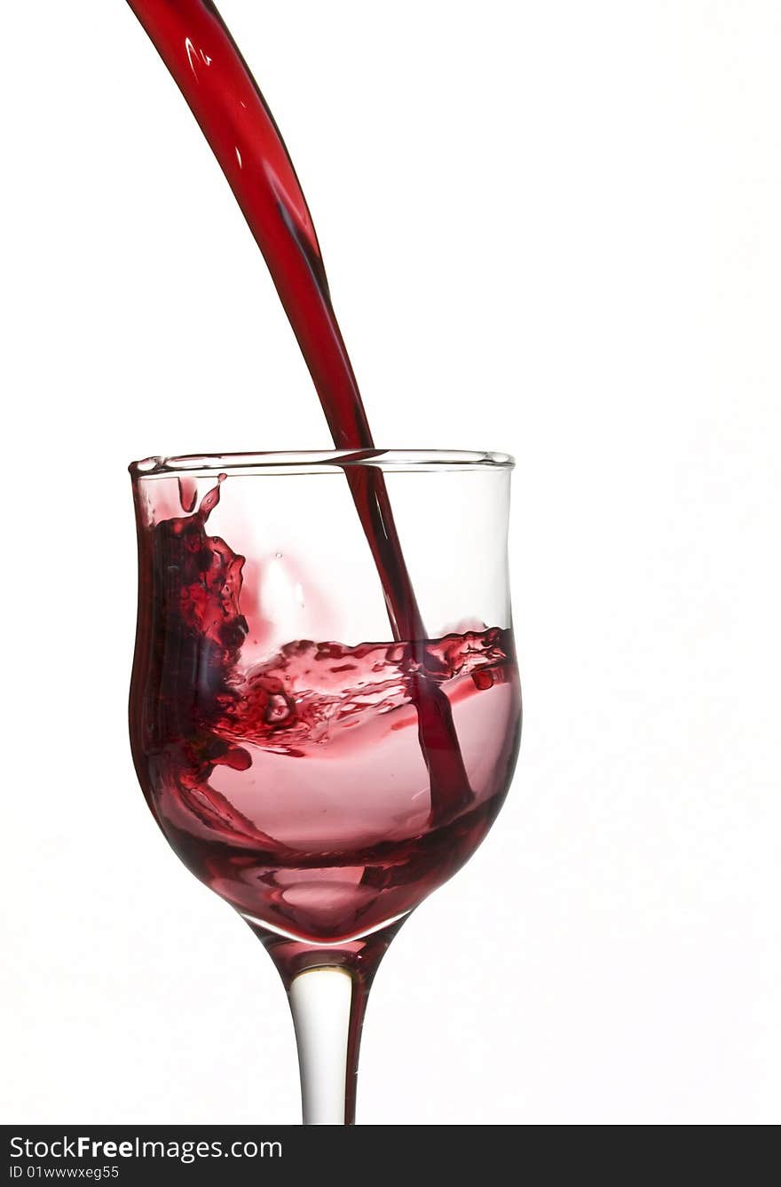 Red wine poured into glass