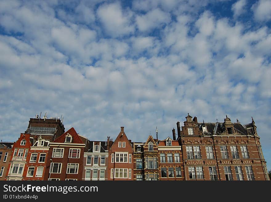 Some nice Amsterdam canal houses in a row with a blue sky. Some nice Amsterdam canal houses in a row with a blue sky