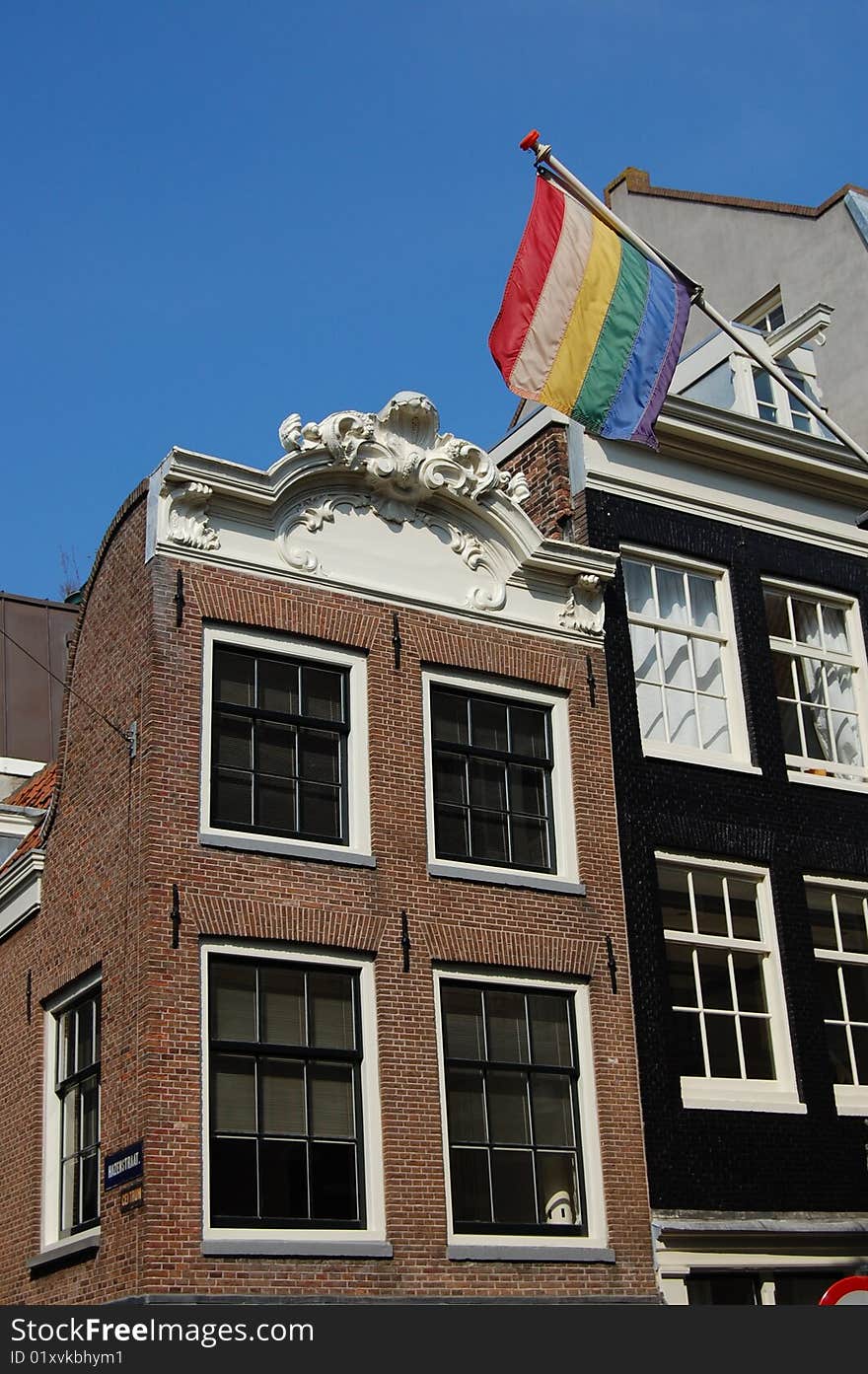 Rainbow Gay Flag With Houses In Amsterdam Holland