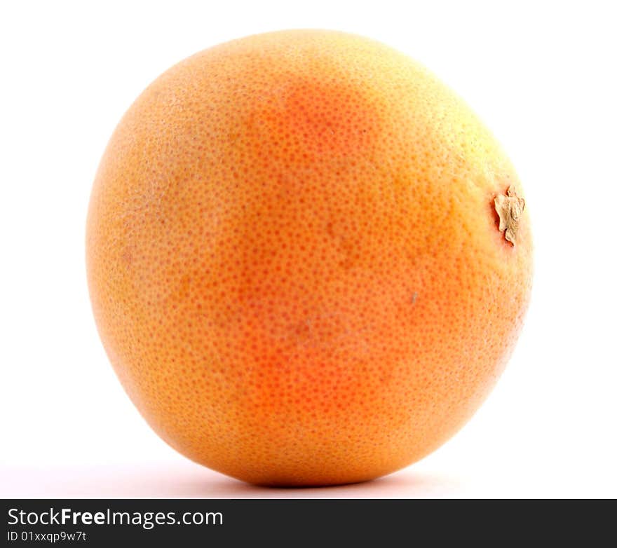 Large grape fruit isolated against white background