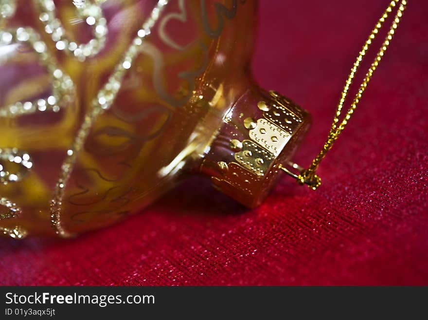 An extreme close-up of a gold chrismas bauble. An extreme close-up of a gold chrismas bauble