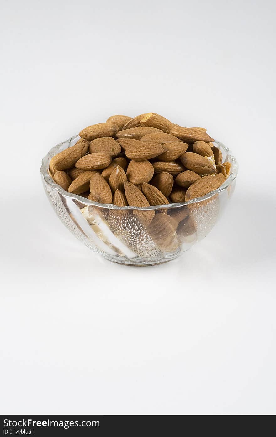 Almonds In A Glass Bowl On White Background