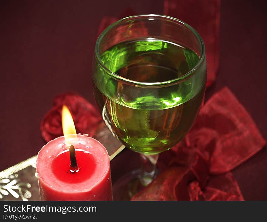 Glass and candle at the party or celebration