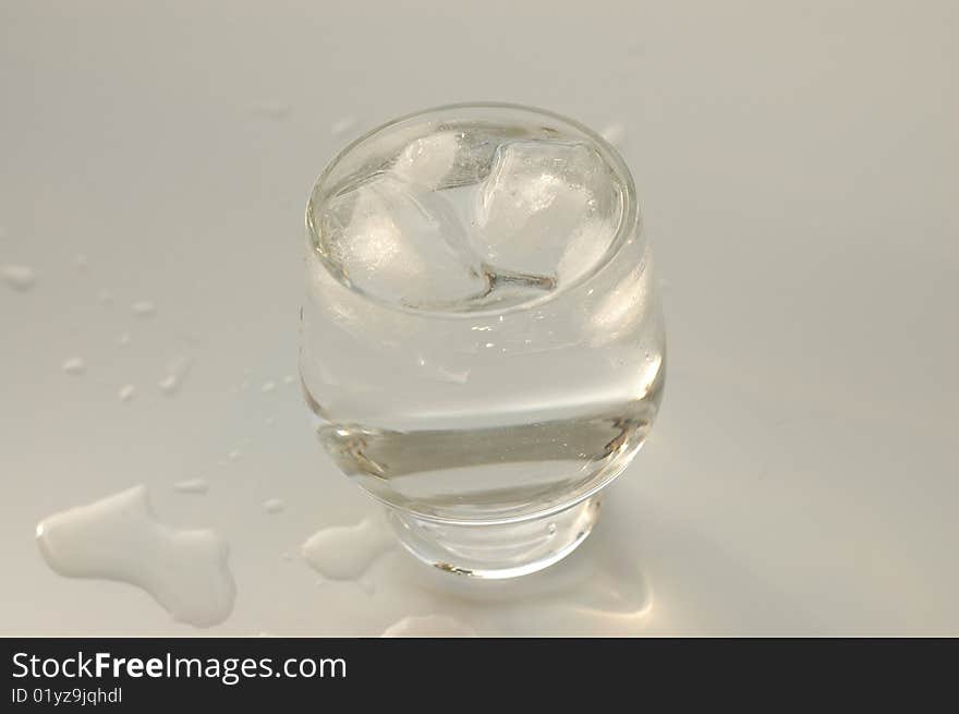 Water with ice in a glass. Water with ice in a glass