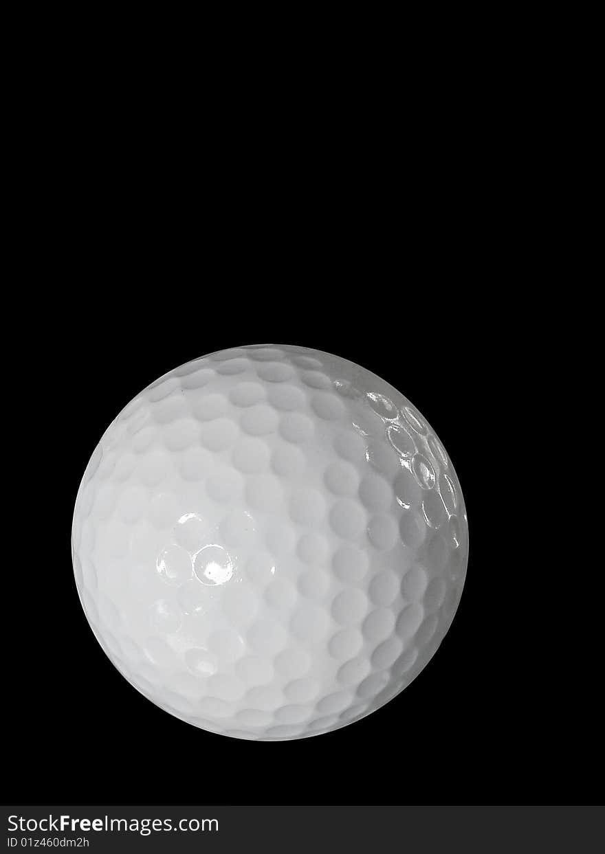 Golf Ball Isolated Against The Black Background.