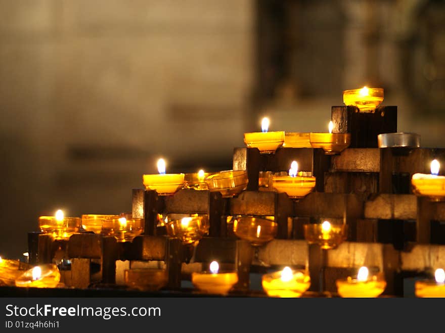 Candles in a church with blurry background