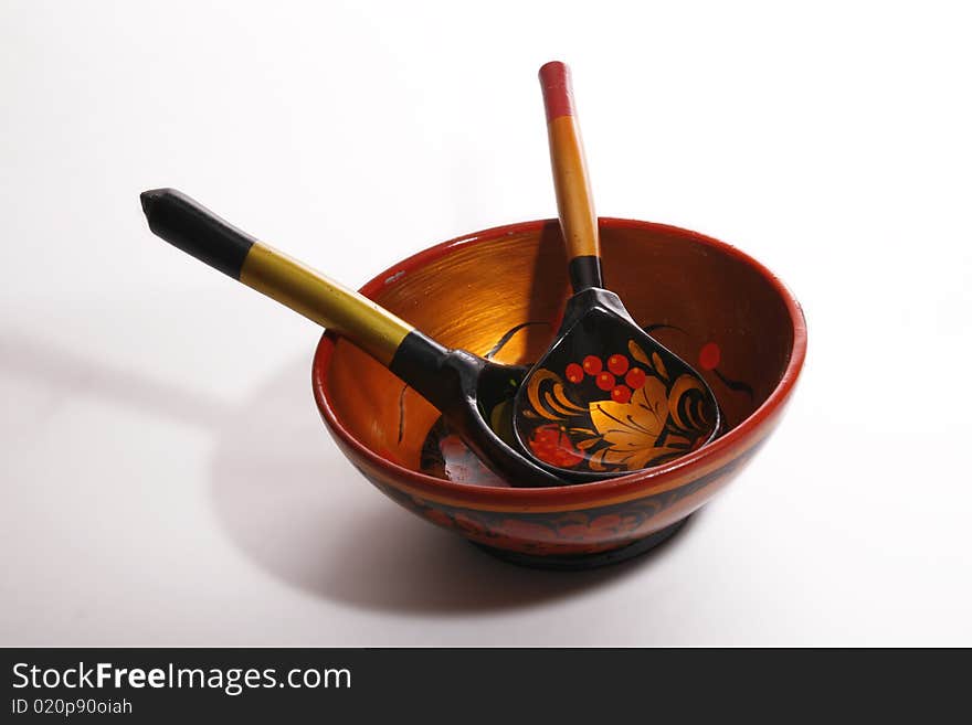 Russian traditional wooden plate and spoons in it. Russian traditional wooden plate and spoons in it.