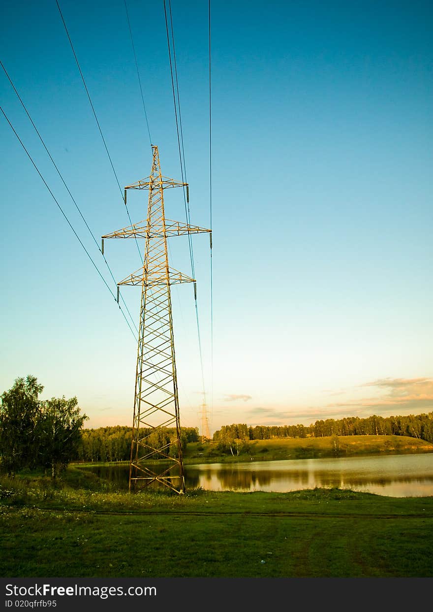 Support of an electric main against the blue sky. Support of an electric main against the blue sky