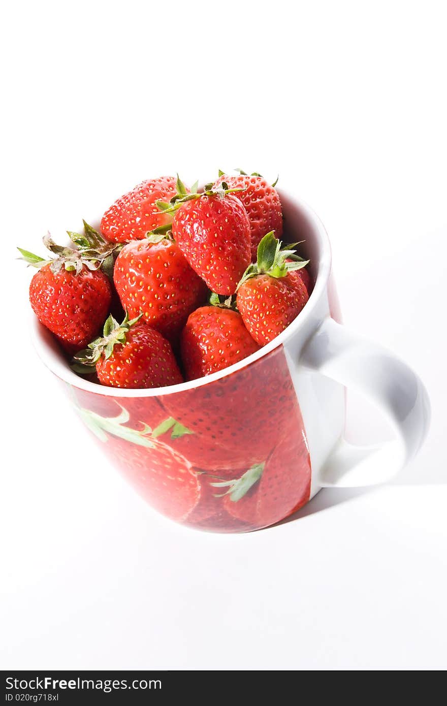 Red cup filled with fresh ripe strawberries. Red cup filled with fresh ripe strawberries